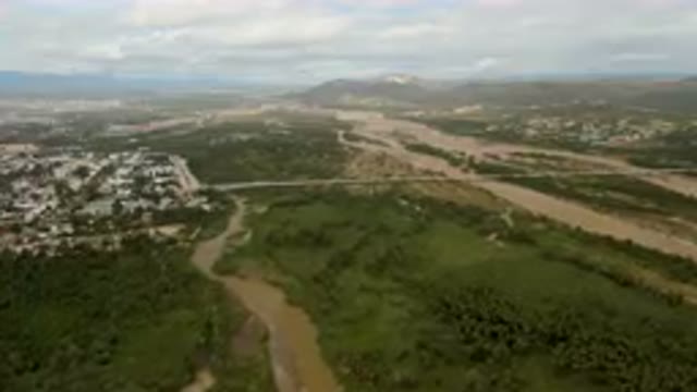 SAN JOSE DEL CABO BCS MEXICO-2023: Aerial River Running Through A Lush Green Valley