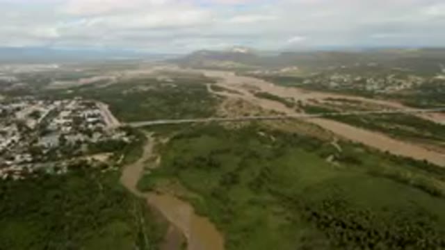 SAN JOSE DEL CABO BCS MEXICO-2023: Aerial River Running Through A Lush Green Valley