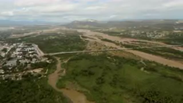 SAN JOSE DEL CABO BCS MEXICO-2023: Aerial River Running Through A Lush Green Valley