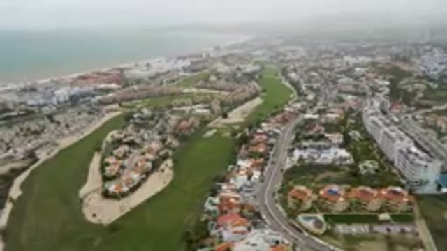 SAN JOSE DEL CABO BCS MEXICO-2023: Aerial Golf Course And A City With A Beach