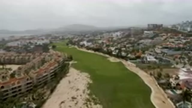 SAN JOSE DEL CABO BCS MEXICO-2023: Aerial Golf Course With A Beach And A City In