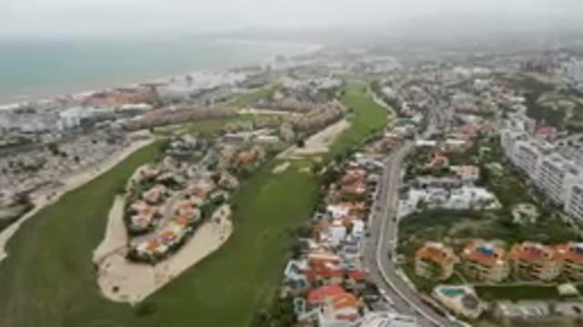 SAN JOSE DEL CABO BCS MEXICO-2023: Aerial Golf Course And A City With A Beach