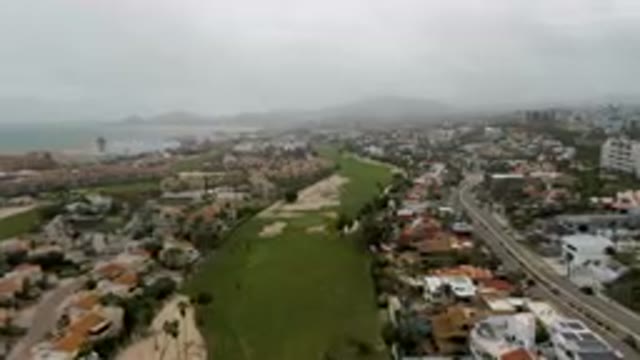 SAN JOSE DEL CABO BCS MEXICO-2023: Aerial Golf Course With A City In The