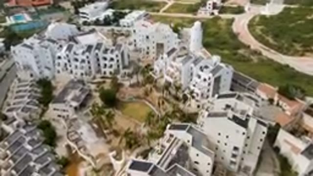 SAN JOSE DEL CABO BCS MEXICO-2023: Aerial View of City With Pond and Buildings