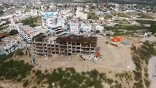 SAN JOSE DEL CABO BCS MEXICO-2023: Building Being Built In A City With A Bus