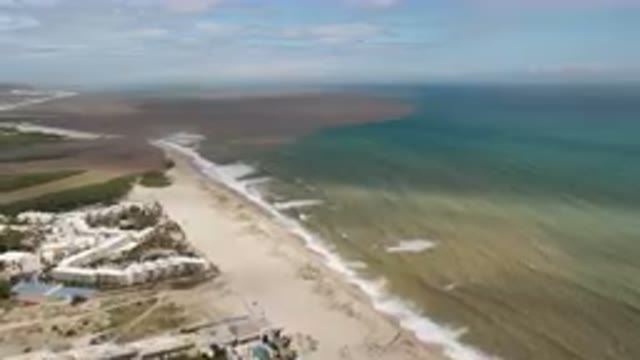 SAN JOSE DEL CABO BCS MEXICO-2023: Aerial Beach With A White Building And A Blue