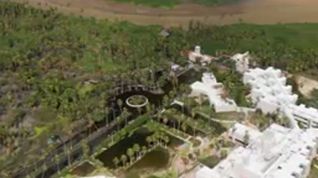 SAN JOSE DEL CABO BCS MEXICO-2023: Aerial Park With A Fountain Surrounded By Palm Trees and Greenery