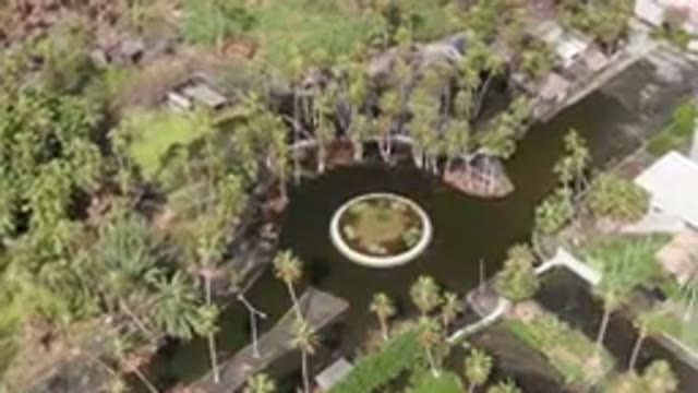 SAN JOSE DEL CABO BCS MEXICO-2023: Aerial Pond Surrounded By Palm Trees And A Fountain