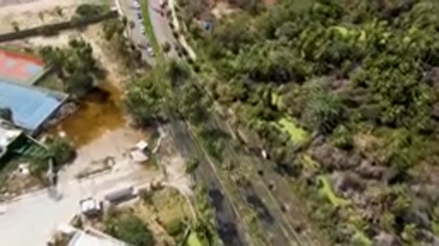 SAN JOSE DEL CABO BCS MEXICO-2023: Aerial Tennis Court Surrounded by Trees