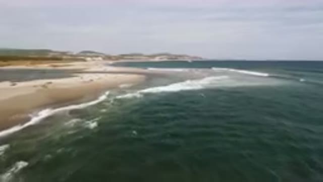 SAN JOSE DEL CABO BCS MEXICO-2023: Surfers Riding Waves On The Beach