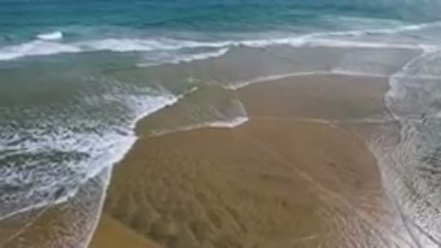 SAN JOSE DEL CABO BCS MEXICO-2023: Pristine Rippling Ocean Waves On Sandy Beach