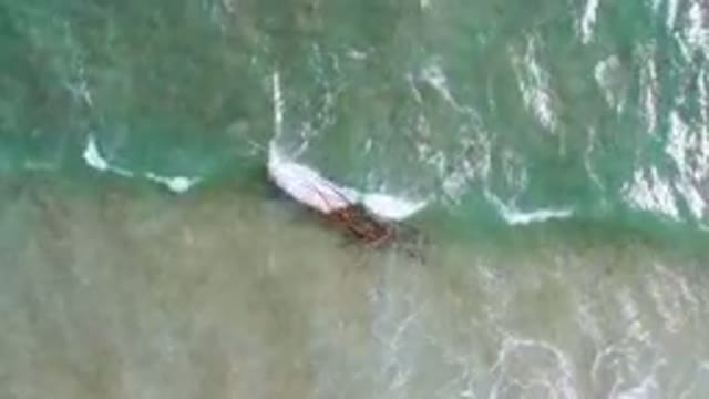 SAN JOSE DEL CABO BCS MEXICO-2023: Boat In The Water With A Long Wooden Pole In