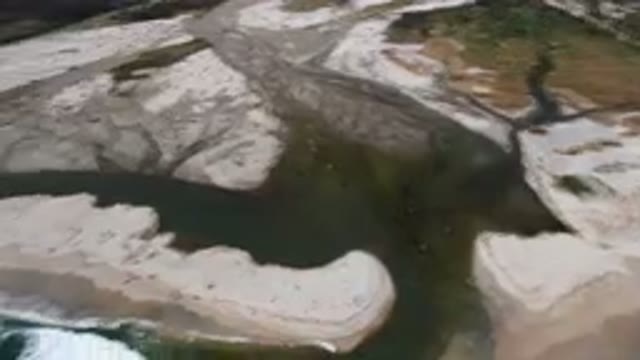SAN JOSE DEL CABO BCS MEXICO-2023: Aerial River Running Through A Sandy Beach