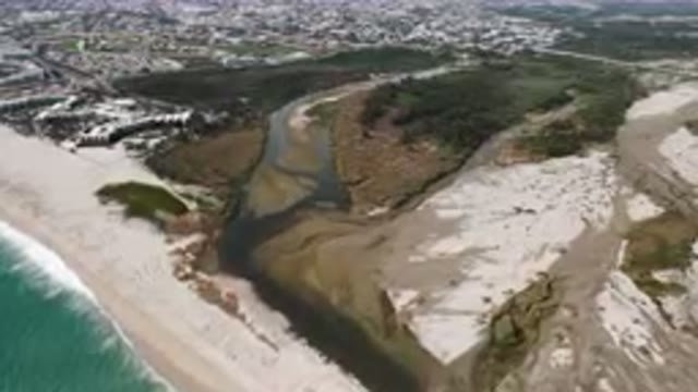 SAN JOSE DEL CABO BCS MEXICO-2023: Aerial River Running Through A Sandy Beach