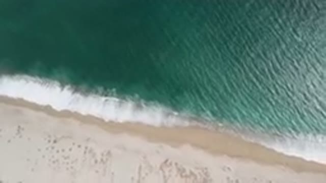 SAN JOSE DEL CABO BCS MEXICO-2023: Aerial Beach With A Surfboard And A Boat