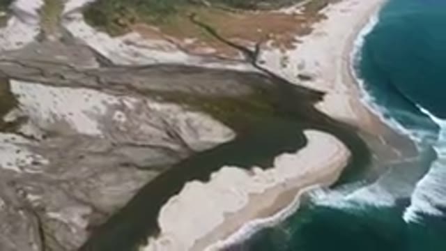 SAN JOSE DEL CABO BCS MEXICO-2023: Aerial River Running Through A Sandy Beach
