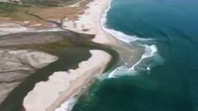 SAN JOSE DEL CABO BCS MEXICO-2023: Aerial River Running Through A Sandy Beach