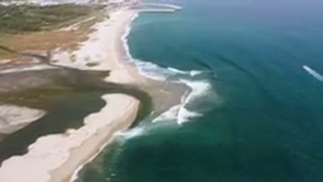 SAN JOSE DEL CABO BCS MEXICO-2023: Aerial Beach And A Body Of Water With A Boat