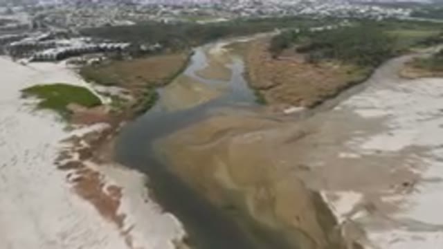 SAN JOSE DEL CABO BCS MEXICO-2023: Aerial River Running Through A Sandy Area