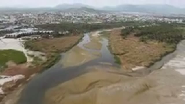 SAN JOSE DEL CABO BCS MEXICO-2023: River Running Through A Dry Grass Field