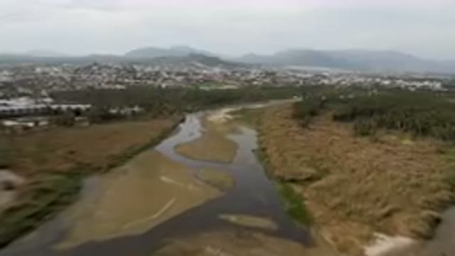 SAN JOSE DEL CABO BCS MEXICO-2023: River Running Through A Lush Green Valley
