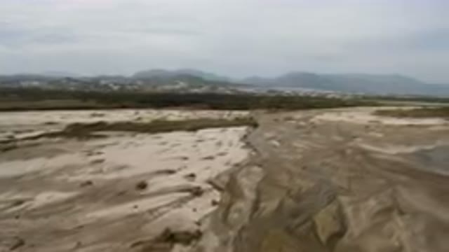 SAN JOSE DEL CABO BCS MEXICO-2023: River Running Through A Sandy Area With