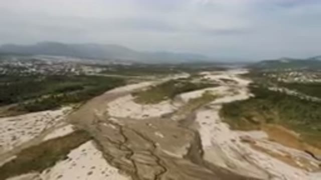 SAN JOSE DEL CABO BCS MEXICO-2023: River Running Through A Valley With A City In