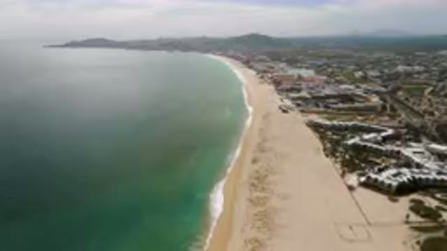 SAN JOSE DEL CABO BCS MEXICO-2023: Aerial Beach And A City With A Long White
