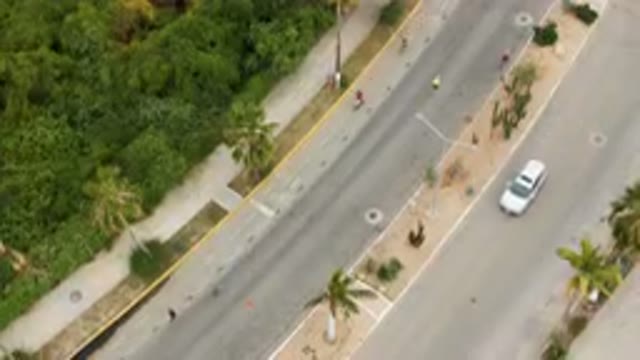 SAN JOSE DEL CABO BCS MEXICO-2023: Aerial Street With A White Car Driving Down