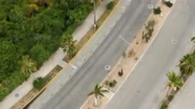 SAN JOSE DEL CABO BCS MEXICO-2023: Aerial Street With A Car Driving Down It