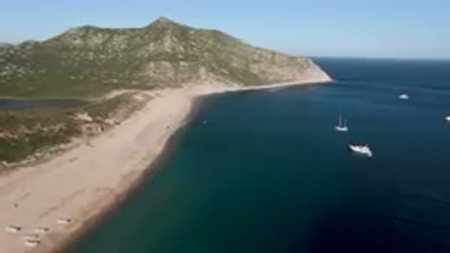 LOS FRAILES BCS MEXICO-2023: Many Boats in the Water Near a Beach