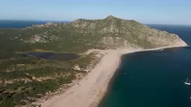LOS FRAILES BCS MEXICO-2023: Large Body Of Water Near A Sandy Beach