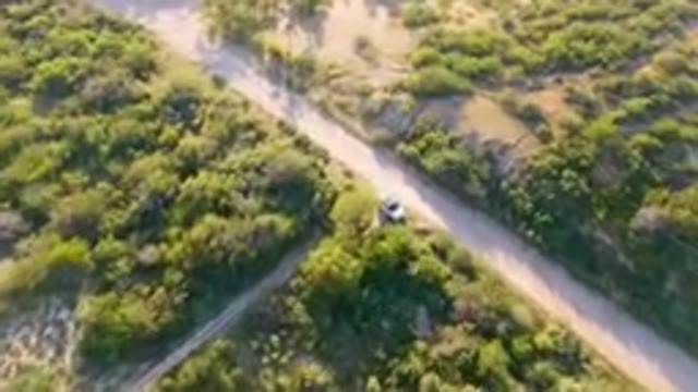 LOS FRAILES BCS MEXICO-2023: Aerial Car Driving Down A Dirt Road In The Middle