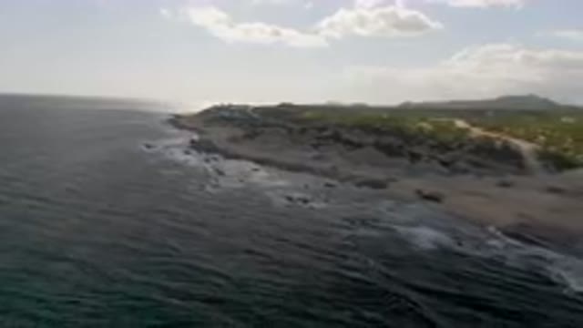 SHIPWRECKS BEACH LOS CABOS BCS MEXICO-2023: Large Body Of Water With A Beach And