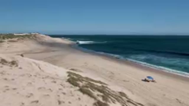 SHIPWRECKS BEACH LOS CABOS BCS MEXICO-2023: Beach With A Blue Umbrella And A