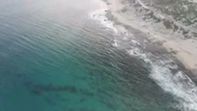 SHIPWRECKS BEACH LOS CABOS BCS MEXICO-2023: Beach And A Cliff With A Body Of Water