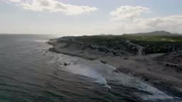 SHIPWRECKS BEACH LOS CABOS BCS MEXICO-2023: Beach And A Hill With A Boat In The