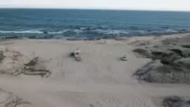 SHIPWRECKS BEACH LOS CABOS BCS MEXICO-2023: Two Vehicles Parked On The Beach