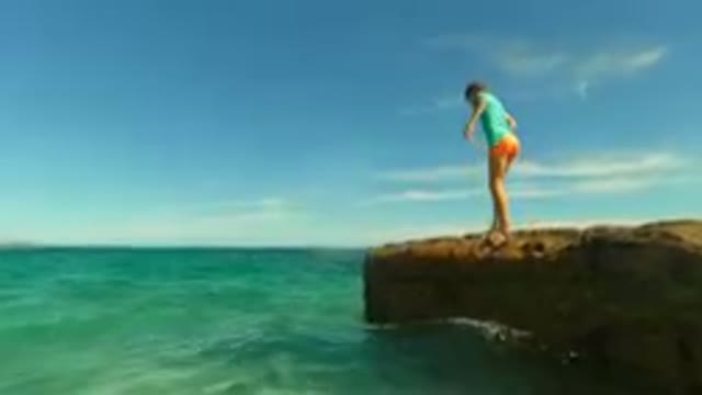 PALMILLA BCS MEXICO-2023: Young Girl Nervous On A Rock In The Ocean