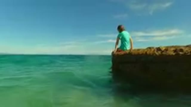 PALMILLA BCS MEXICO-2023: Young Girl Sitting on a Rock in Calm Waters