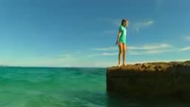 PALMILLA BCS MEXICO-2023: Young Girl Standing On A Rock In The Ocean