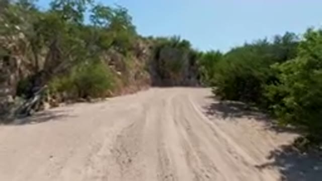 CABO PULMO BCS MEXICO-2023: Dirt Road With A Steep Cliff In The Background
