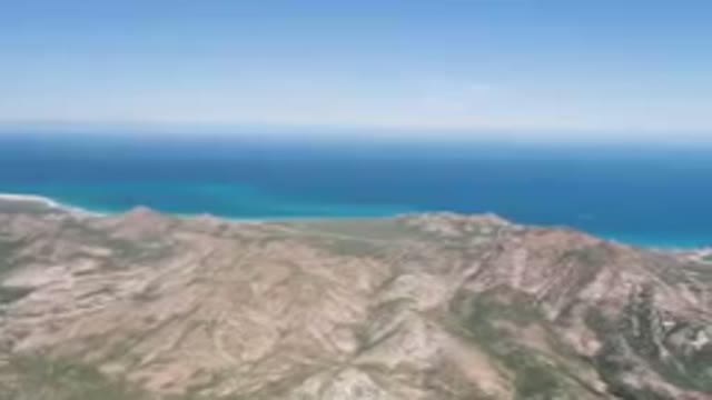 CABO PULMO BCS MEXICO-2023: Mountain With A Body Of Water In The Background