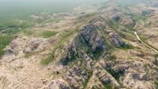 CABO PULMO BCS MEXICO-2023: Aerial View of a Winding Road Through Rocky Hills and a Mountain Valley