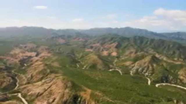 CABO PULMO BCS MEXICO-2023: Aerial View of Winding Road Through Arid Mountains and Palm Forest