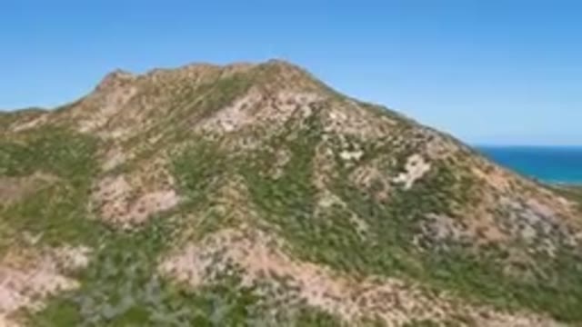 CABO PULMO BCS MEXICO-2023: Mountain With A Blue Ocean In The Background