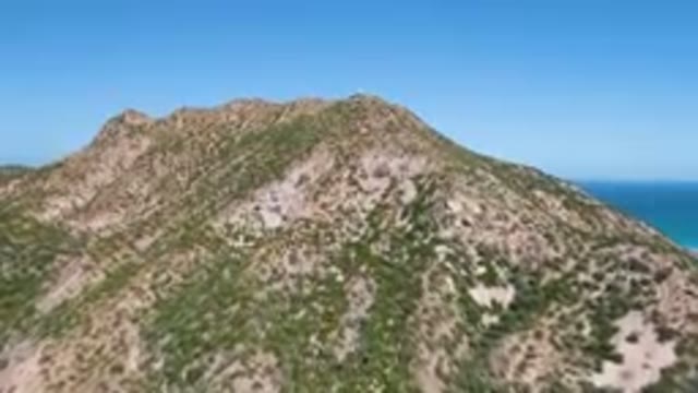 CABO PULMO BCS MEXICO-2023: Mountain With A Blue Ocean And A Clear Sky