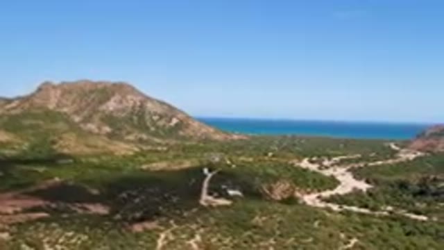CABO PULMO BCS MEXICO-2023: Winding Road In A Mountainous Area With A Mountain