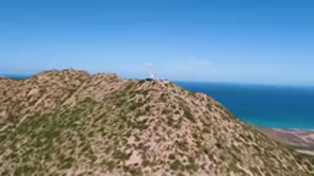 CABO PULMO BCS MEXICO-2023: Hill With A Lighthouse On Top Of It