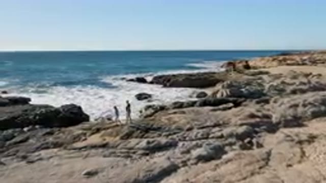 LAGUNA BEACH LOS CABOS BCS MEXICO-2023: Family Walking Rocky Coast